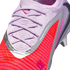 Close-up of a Nike soccer cleat with a light purple knit upper, matching laces, and a vibrant red-orange textured section outlined in silver.