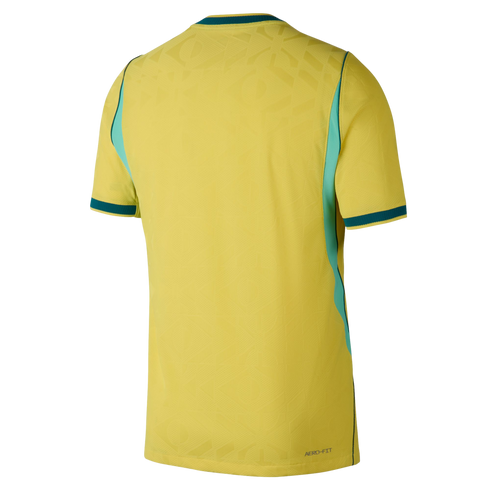 A back view of a short-sleeved yellow athletic jersey with teal and mint green accents on the side panels, collar, and cuffs. The fabric features a subtle tonal geometric pattern, and the words "AERO-FIT" are printed in small dark letters on the bottom ri