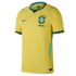A bright yellow Brazil national football team home jersey by Nike, featuring a subtle geometric pattern, a teal Nike swoosh, and the CBF team crest on the chest.