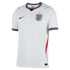 The front of a white short-sleeved England home football jersey. It features the England Three Lions crest on the chest with a single gold star above it, and a dark blue Nike swoosh on the opposite side. The V-neck and sleeve cuffs have dark blue, red, an