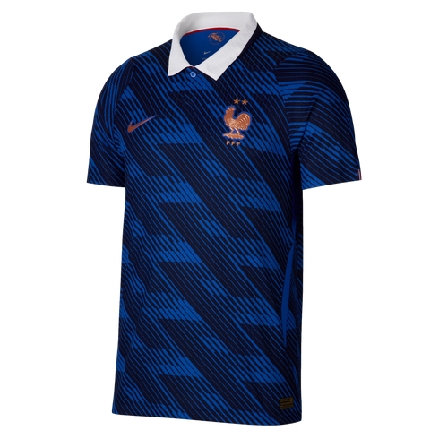 A blue France national soccer jersey featuring a white polo collar, gold crest and Nike logo, and a repeating diagonal line pattern.