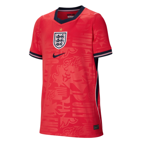 Red England football jersey featuring a central Three Lions crest, navy Nike swoosh, navy V-neck collar, and tonal graphic patterns.