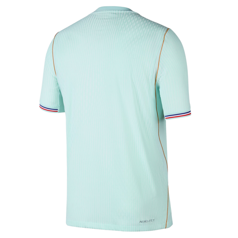 Back view of a light blue ribbed jersey with red, white, and blue striped cuffs, gold piping, and "AERO-FIT" branding on a black background.