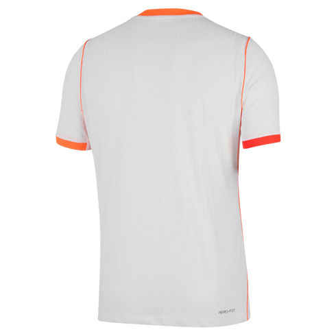 The back view of a white, short-sleeved athletic jersey with bright orange accents on the crew neck, sleeve cuffs, and shoulder seams. The white fabric features a fine vertical ribbed texture, and "AERO-FIT" is printed in small grey text at the bottom rig