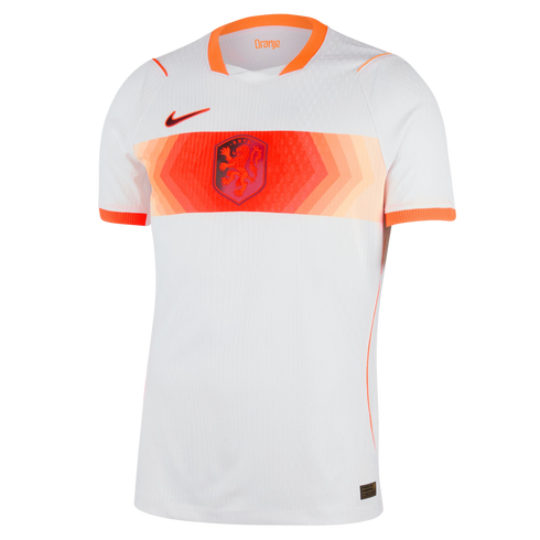 A white short-sleeved Nike football jersey featuring a wide horizontal band across the chest in varying shades of orange. Centered on the band is the Netherlands KNVB lion crest, with an orange Nike swoosh on the upper right chest and orange trim on the c