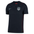 Dark navy Nike USA soccer jersey with silver team crest and swoosh. Features a tonal star pattern across the chest and thin red piping on the shoulders and sides.