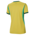 Back view of a yellow athletic jersey with short sleeves, green trim on the collar and cuffs, and green vertical side panels against a black background.