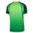 Back view of a green sports jersey with a yellow-to-green gradient dot pattern, dark green sleeves, and white cuffs.