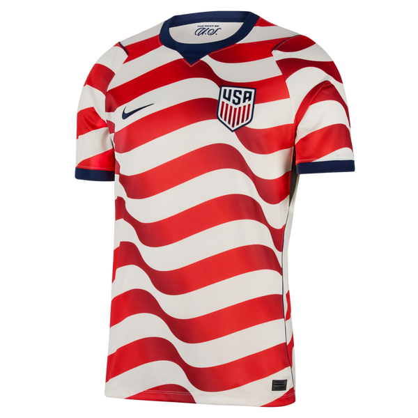 Nike USA soccer jersey with wavy red and white horizontal stripes, dark blue collar and cuffs, and the U.S. Soccer Federation crest on the chest.