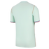 Back view of a mint green short-sleeved jersey with orange piping and red, white, and blue striped cuffs, set against a black background.