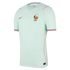 Mint green Nike France football jersey with gold FFF rooster crest, two stars, gold piping, and tricolor sleeve trim.