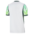 Back view of a white sports jersey featuring sleeves with an abstract green and lime pattern and dark green accents on the collar, cuffs, and sides.