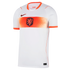 A white Nike Netherlands national team soccer jersey with orange accents. A wide orange band with a geometric chevron pattern stretches across the chest, featuring the KNVB lion crest in the center. It has an orange v-neck collar and sleeve cuffs, with a