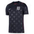 Black Nike USA soccer jersey with an all-over grey star pattern, featuring a central USA crest, white swoosh, and thin red trim.