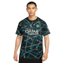 A man wearing a black Inter Milan soccer jersey with a teal geometric constellation pattern and white Qatar Airways logo, set against a plain white background.
