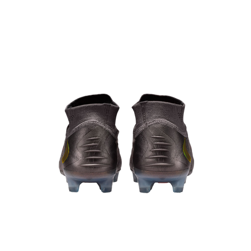 A rear view of a pair of dark grey soccer cleats with high-top knit collars, featuring five horizontal ridges on each heel and translucent studs, set against a solid black background.