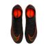 An overhead view of a pair of black Nike Mercurial soccer cleats with vibrant orange accents and black laces, set against a solid black background. The shoes feature large orange swooshes on the forefoot and bright orange interior linings with "MERCURIAL"