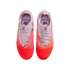 Top-down view of pink and orange Nike soccer cleats with "Alexia Putellas" branding on the insoles. The shoes feature silver accents and a gradient design.