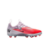 Profile of a Nike Phantom soccer cleat in pink, coral, and silver with a black swoosh and red studs, set against a black background.