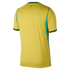 Rear view of a yellow short-sleeved jersey with green trim on the collar and sleeve cuffs, and green panels on the sides, set against a black background.