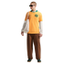 A man in a yellow Australia soccer jersey, white long-sleeved shirt, brown pants, and green sneakers carries a white tote bag against a black background.