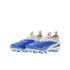 A pair of blue and cream Nike soccer cleats with yellow accents and a textured upper, shown against a solid black background.