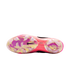 Sole of a pink iridescent Nike Tiempo soccer cleat with clear studs and a black swoosh, featuring the text "Crafted for Brilliance" against a white background.