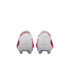 A rear view of a pair of white Nike soccer cleats with vibrant pink side panels and iridescent soleplates.