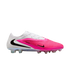 Side profile of a white and vibrant pink Nike soccer cleat with black Swoosh logos and an iridescent studded sole, isolated on a white background.