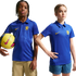Two children wearing blue Nike Chelsea FC polo jerseys pose against a white background. The boy on the left holds a yellow soccer ball.