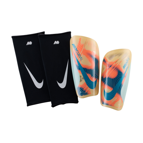 Nike Mercurial Mbappe shin guards with vibrant orange and teal graphics alongside two black Nike compression sleeves, set against a solid black background.