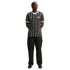 Full-length shot of a man in a black and white striped Corinthians soccer jersey, black pants, and black sneakers, standing against a solid black background.