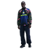 A man models a long-sleeve Nike Nigeria soccer top with a colorful abstract pattern on the sleeves and navy pants against a solid black background.