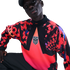 A person wearing a Nike USA soccer long-sleeve shirt featuring a bold red and black star pattern and the USA crest, set against a black background.