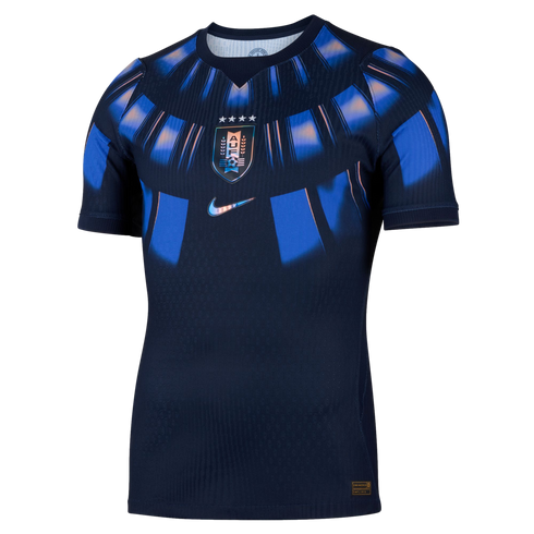 Navy blue Nike Uruguay national soccer jersey featuring iridescent blue sunburst patterns and a centered team crest with four stars.