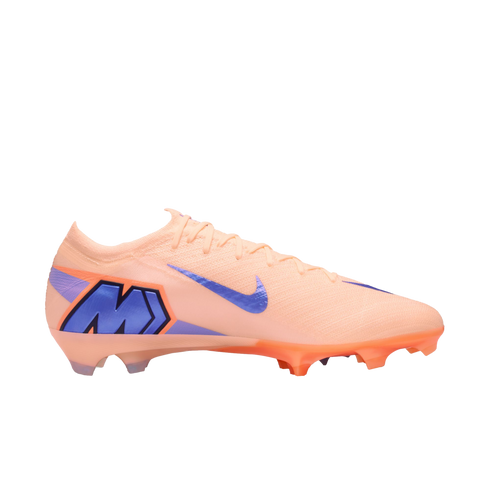 Profile view of a peach Nike Mercurial soccer cleat with a blue swoosh and large "M" logo on the heel, isolated against a black background.