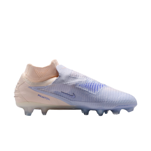 Nike Phantom soccer cleat in pale pink and light blue on a black background. It features a laceless design, high-top sock collar, and firm ground studs.