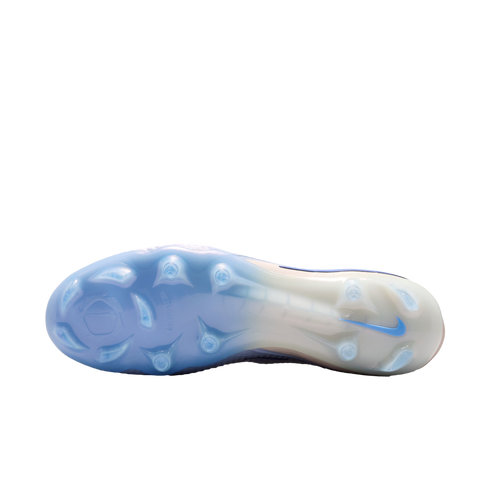 Translucent light blue and white soleplate of a Nike soccer cleat with molded studs.