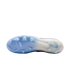 Translucent light blue and white soleplate of a Nike soccer cleat with molded studs.