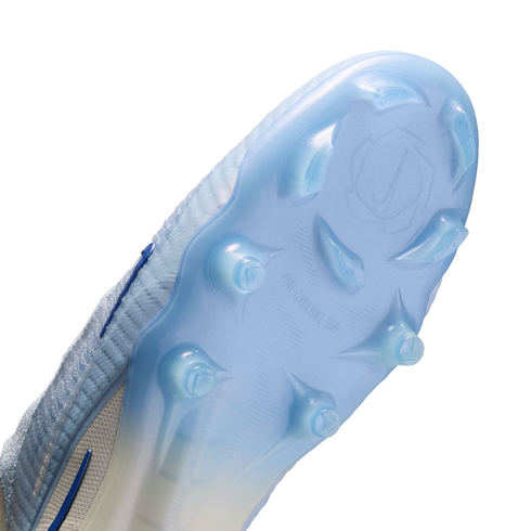 The underside of a light blue Nike soccer cleat showing the "NIKE CYCLONE 360" soleplate and stud pattern against a black background.