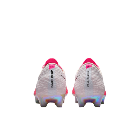 Rear view of Nike Mercurial Superfly soccer cleats featuring a white textured upper, pink accents, and iridescent heel plates. The heels show vertical 'MERCURIAL' and 'SUPERFLY' text.