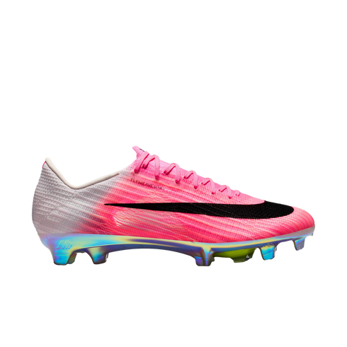 Side view of a pink and white Nike soccer cleat with a large black swoosh and a shiny, iridescent multi-colored sole plate.