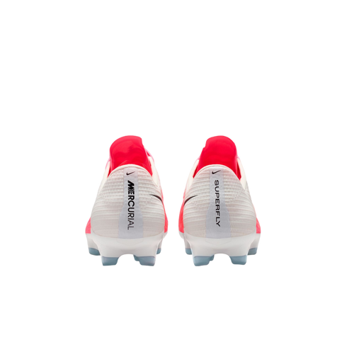 Rear view of white and bright pink Nike Mercurial Superfly soccer cleats showing the heel branding and light blue studs against a white background.