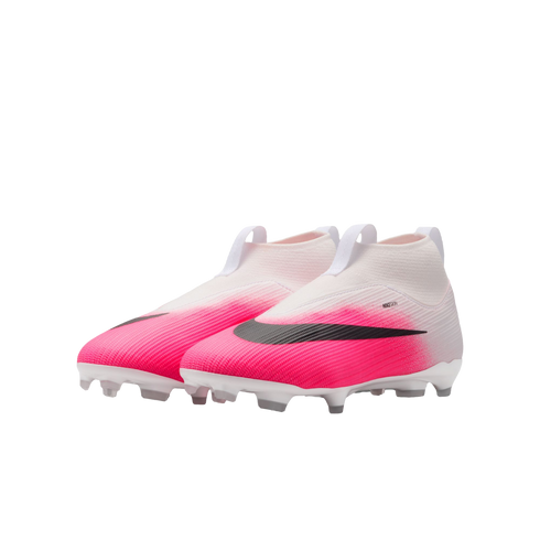 A pair of laceless Nike soccer cleats featuring a white-to-vibrant-pink gradient upper, black swooshes, and white studs on a plain background.