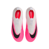 Top-down view of white and neon pink Nike Mercurial Superfly soccer cleats with large black swooshes and red insoles.