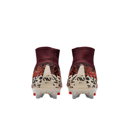 A rear view of a pair of Nike soccer cleats featuring high-top maroon ankle collars and animal print patterns in orange, black, and cream. Each cream-colored heel counter displays a stylized "NU" logo and a small Nike swoosh.
