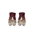 A rear view of a pair of Nike soccer cleats featuring high-top maroon ankle collars and animal print patterns in orange, black, and cream. Each cream-colored heel counter displays a stylized "NU" logo and a small Nike swoosh.