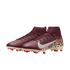 A pair of burgundy high-top Nike soccer cleats featuring a textured upper, a white swoosh with a red outline, and a bold leopard print pattern on the heel. The shoes have a cream-colored outsole with vibrant red studs, set against a solid black background