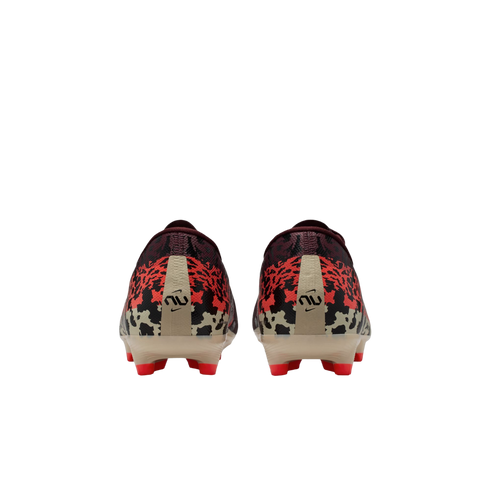 Rear view of a pair of Nike soccer cleats featuring a pixelated camouflage pattern in red, black, and maroon, with tan heel strips and bright red studs against a black background.