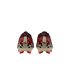 Rear view of a pair of Nike soccer cleats featuring a pixelated camouflage pattern in red, black, and maroon, with tan heel strips and bright red studs against a black background.